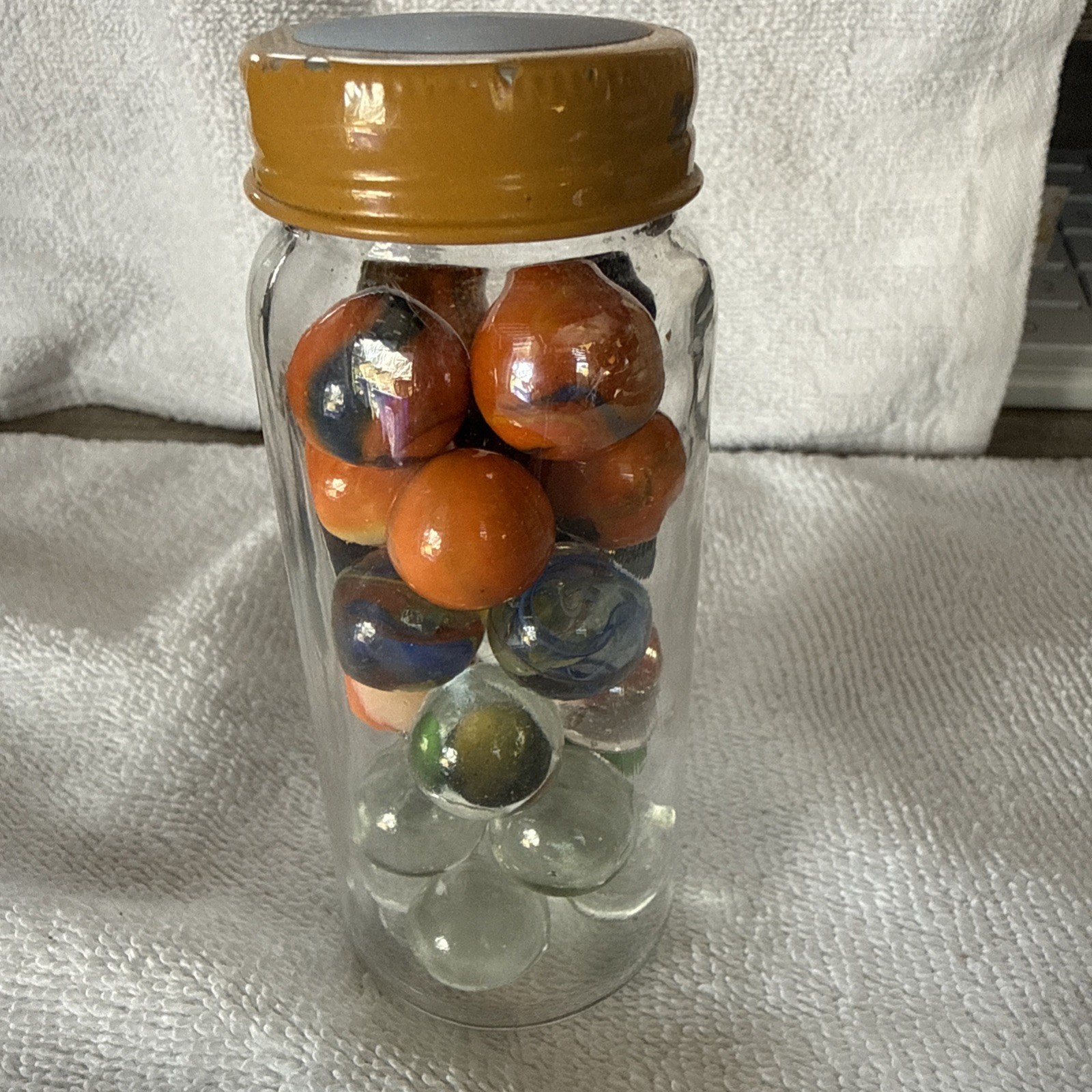A Jar Of 24 Marbles Including The Jar, Which Is Kind Of Cool Looking!