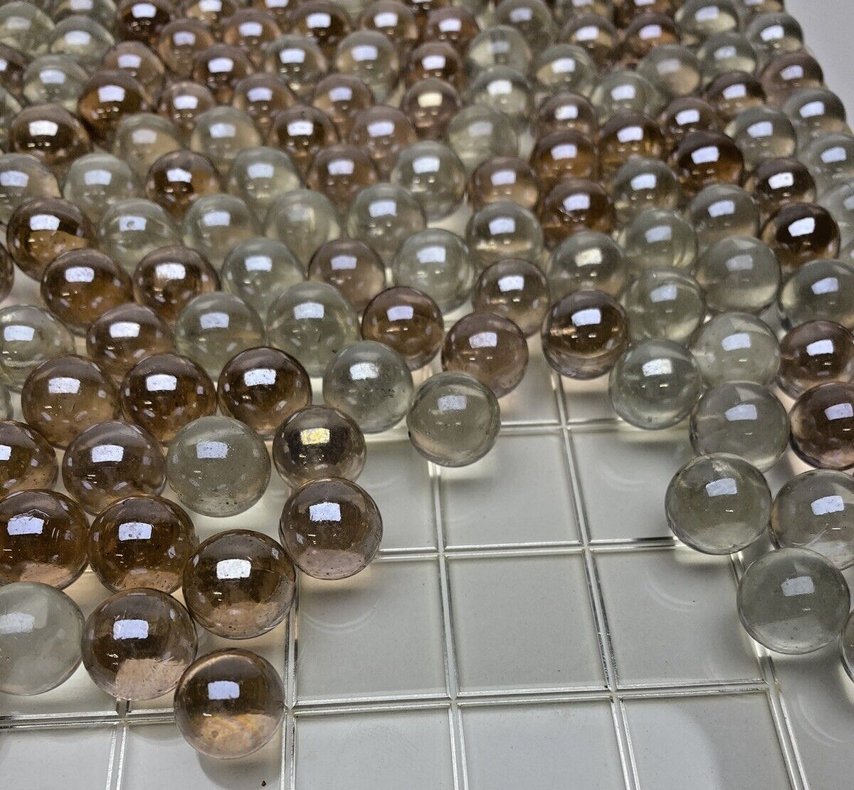 Lot of 600+ SHINY LIGHT IRIDIZED PINK COLOR – ROUND GLASS MARBLES .550″ CLEAR