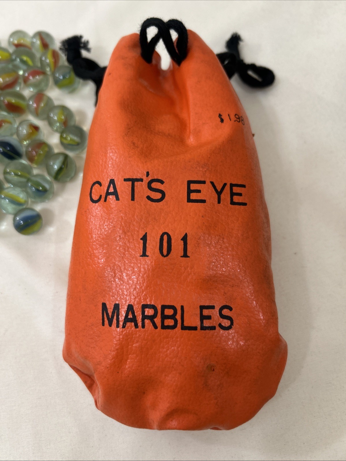 101 CAT’S EYE Marbles In Orange Drawstring Vinyl Bag