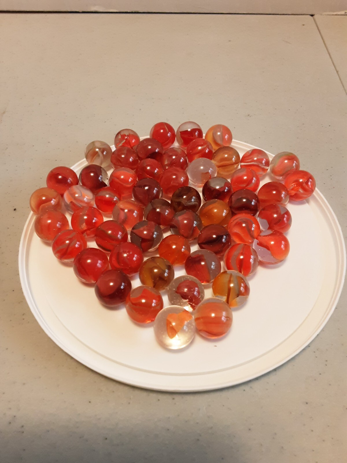 53 Vintage orange/multi toned cats eye marbles, from 1960’s
