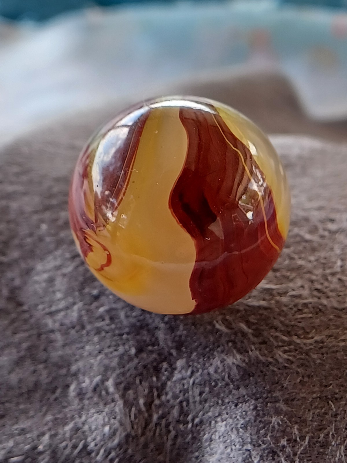 “Golden Onyx Oxblood” .70 Shiney wet dead mint. Very old and rare marble. 1920s