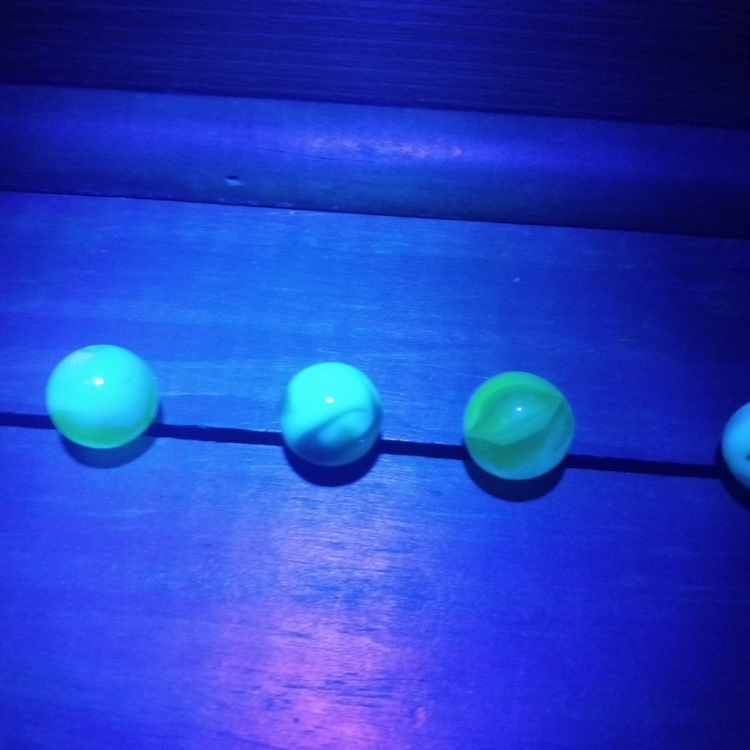 4 Vtg Uranium Glass Swirl Shooters Marbles UV Reactive Blacklight Glow Vaseline