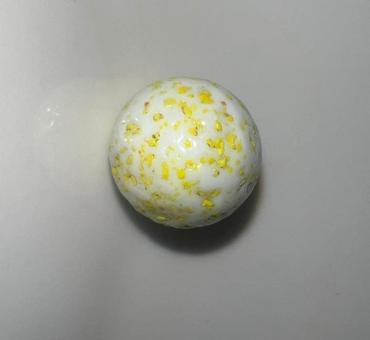 21 vintage handmade glass marbles with colorful swirls and unique patterns.