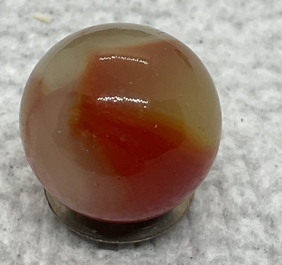 A Vintage Akro Agate Carnelian UV Marble. It Measures .70”, Near Mint Condition