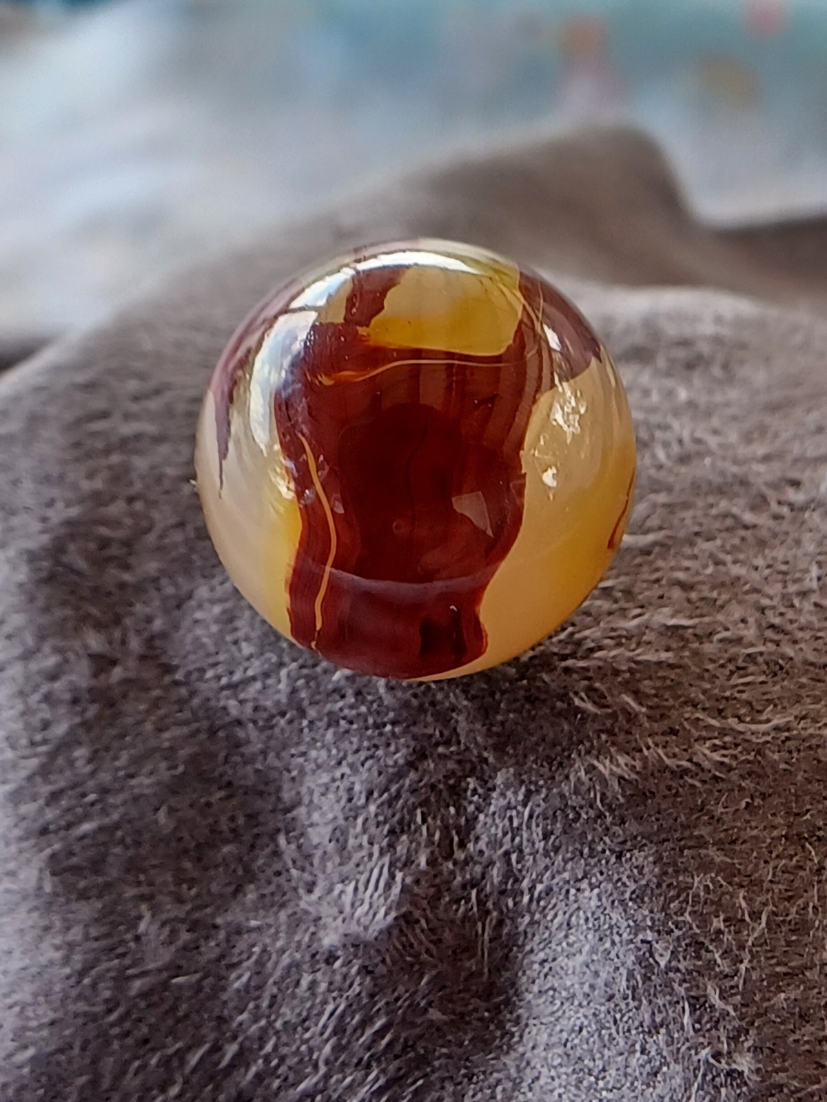 “Golden Onyx Oxblood” .70 Shiney wet dead mint. Very old and rare marble. 1920s