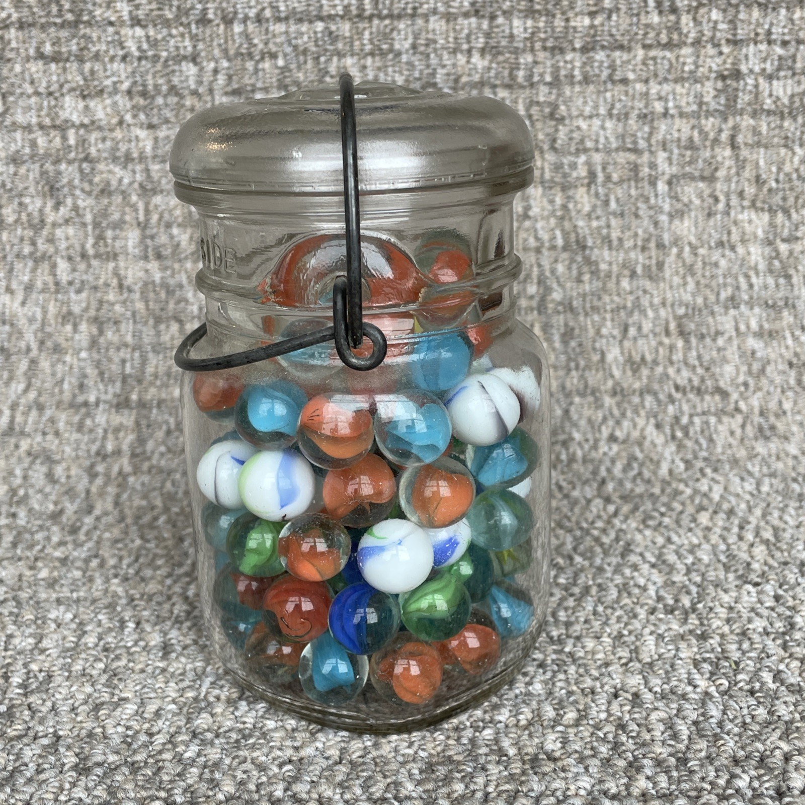 Vintage Glass Ball Ideal Jar Filled With Marbles. Jar Is 5 1/2” Tall.