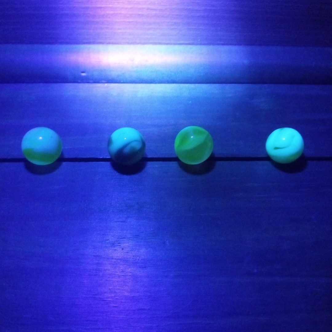 4 Vtg Uranium Glass Swirl Shooters Marbles UV Reactive Blacklight Glow Vaseline