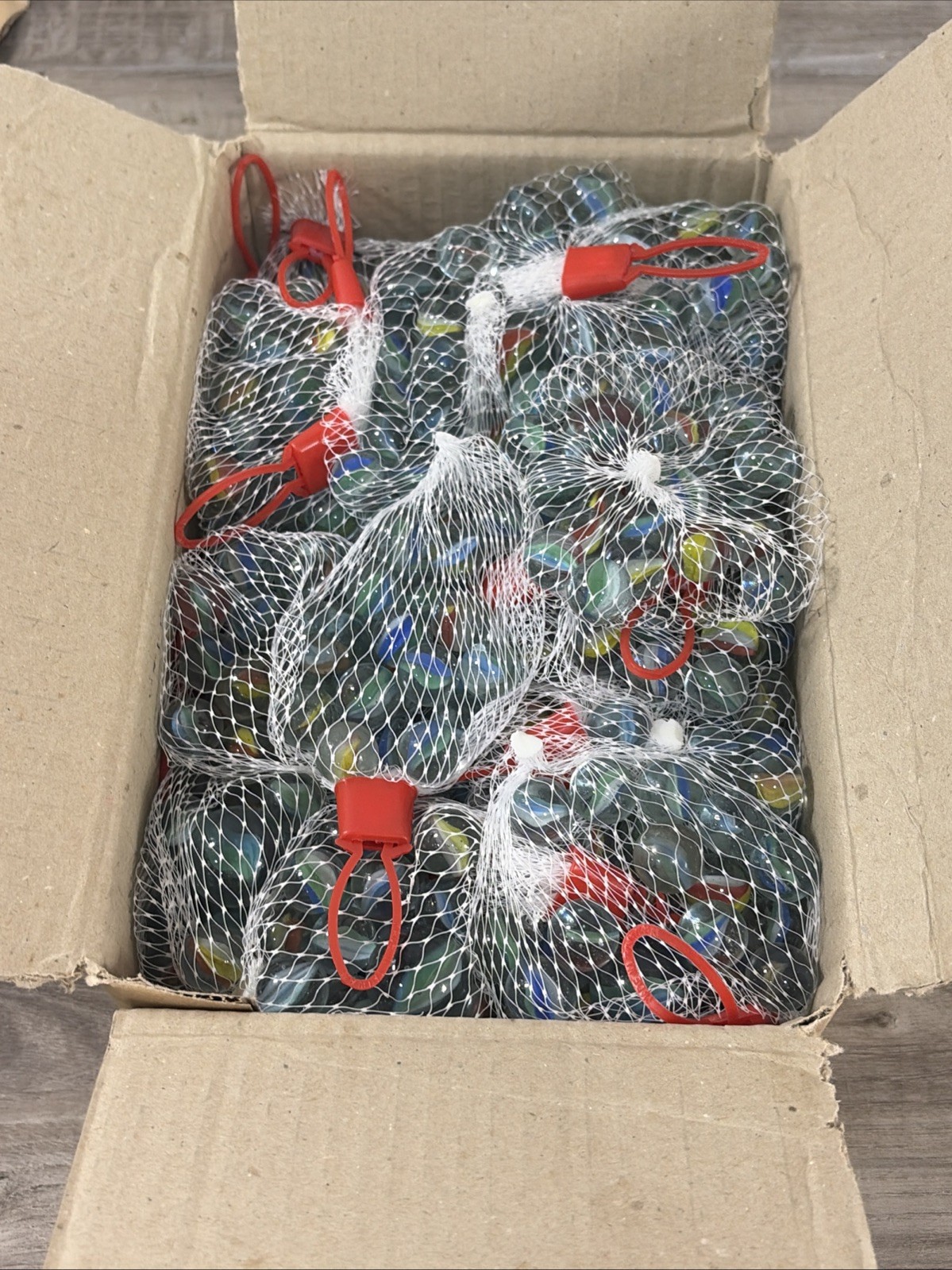 BOX OF 36 glass marble sets – netted bag of Approx 21 assorted marbles