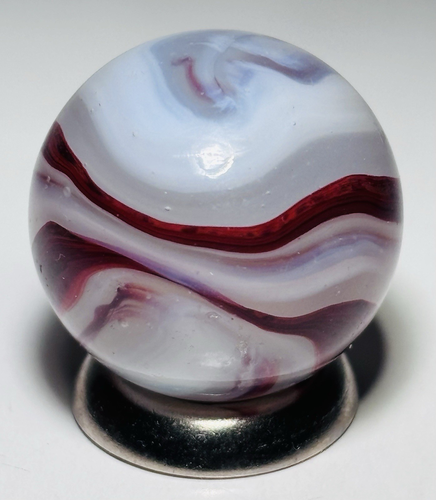 Vintage Akro Agate Silver OXblood Corkscrew Marble.72” In Mint Condition
