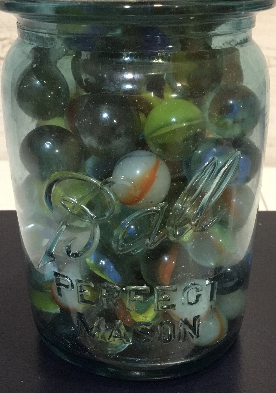 Antique Ball Perfect Mason jar, zinc lid, filled with assorted vintage marbles.