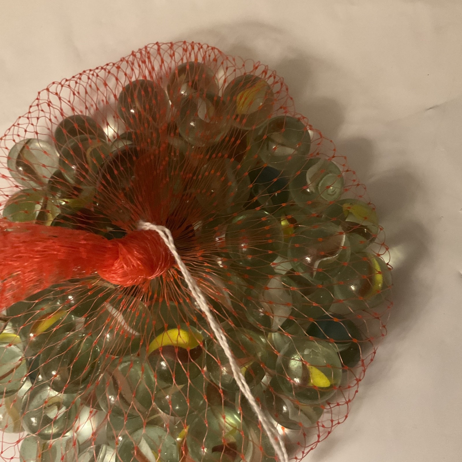 Glass Marble Set – Netted Bag of Approx 31 Assorted Marbles, One Big One.