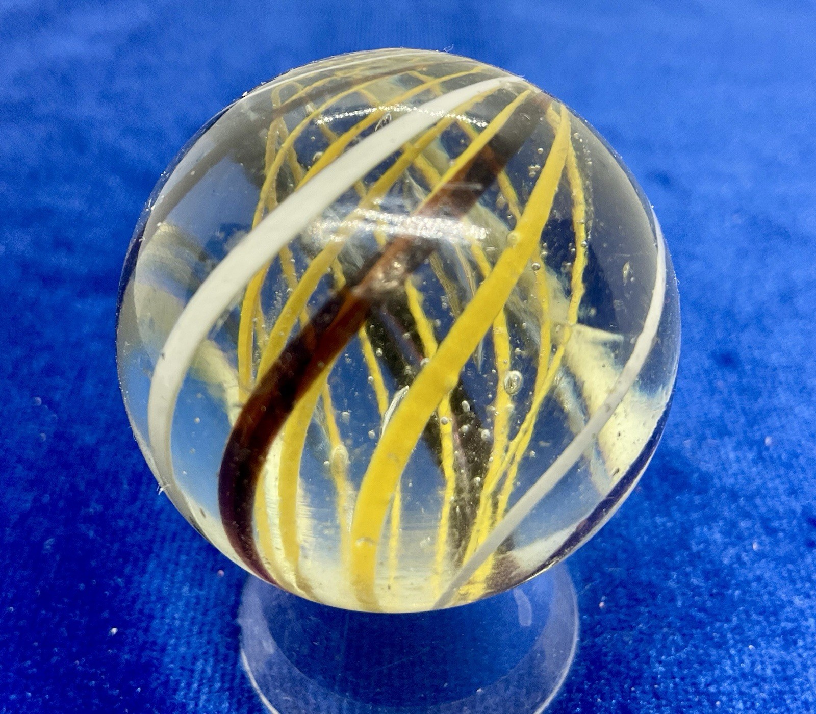A vintage German Handmade Yellow Latticinio Marble. Measures 1.59 “ Near Mint.