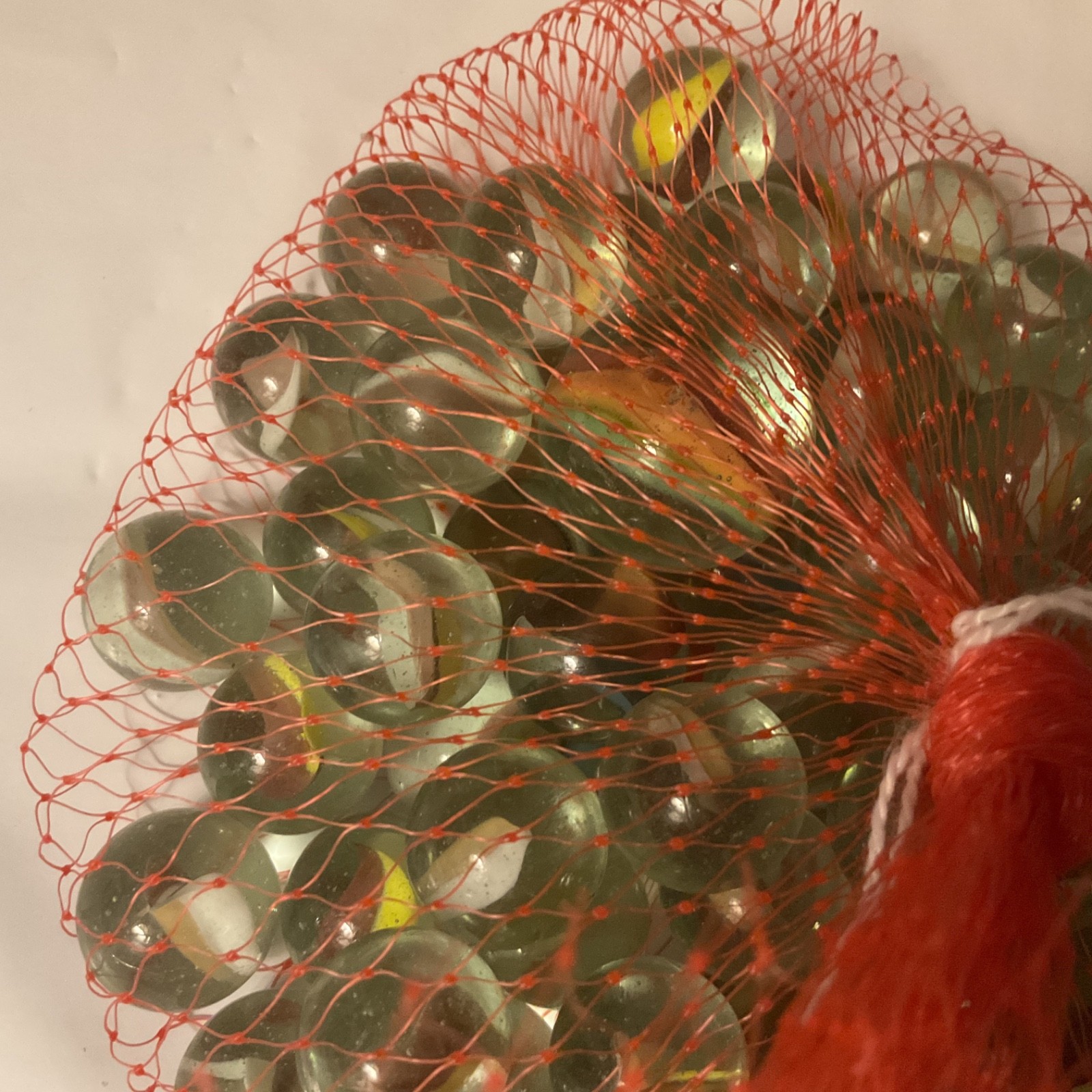 Glass Marble Set – Netted Bag of Approx 31 Assorted Marbles, One Big One.