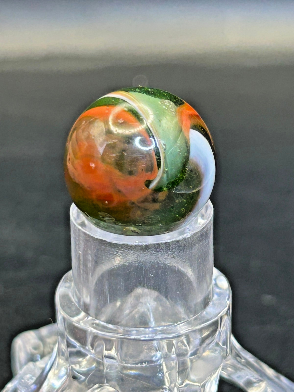 Peltier NLR Tri-Lite Marble, Green Base/Orange-Red Ribbon, UV Reactive, .63″ P28