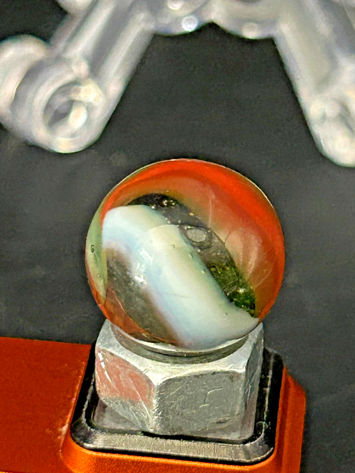Peltier NLR Tri-Lite Marble, Green Base/Orange-Red Ribbon, UV Reactive, .63″ P28