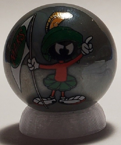 Marvin the Martian w/ Flag Gray Glass 1″ Logo Marble w/ Stand