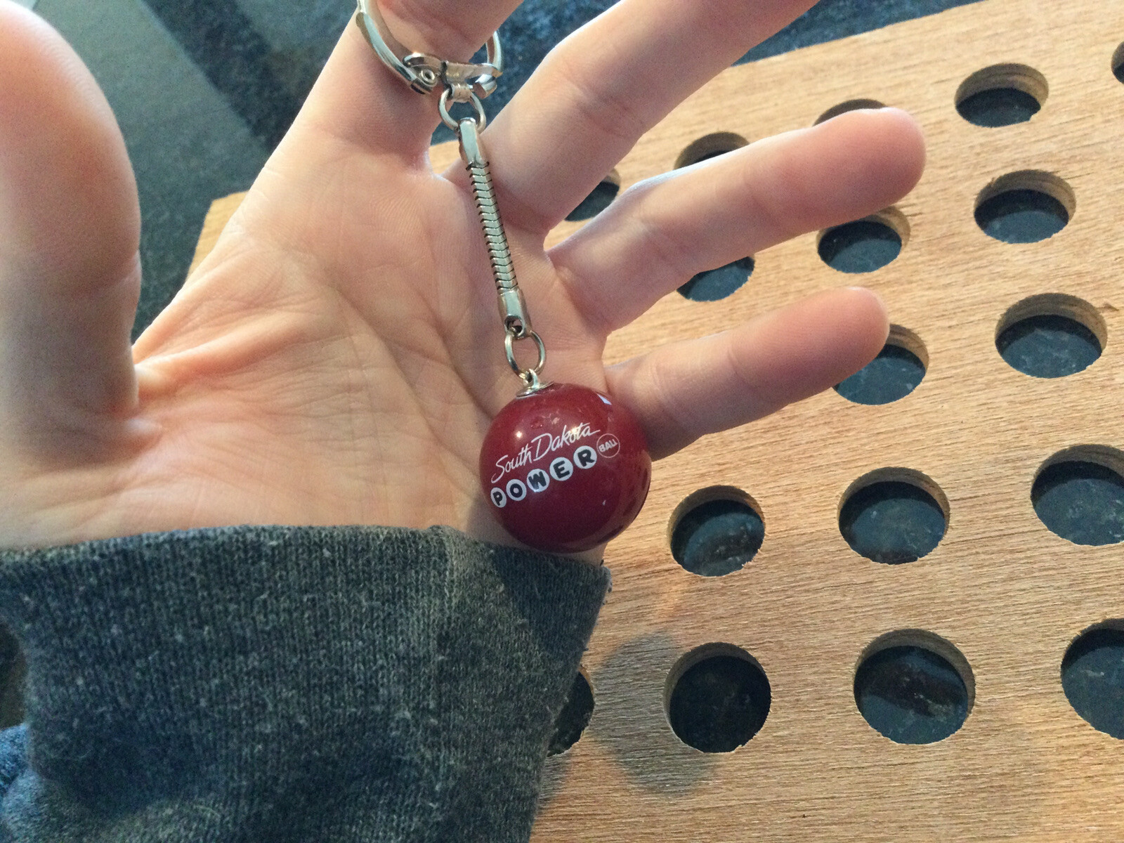 Vintage |”South Dakota Powerball”| White & Black Print on Red Marble Keychain