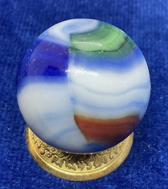 A Vintage Marble King Multi Colored AV Marble. Measures .90” Good Condition