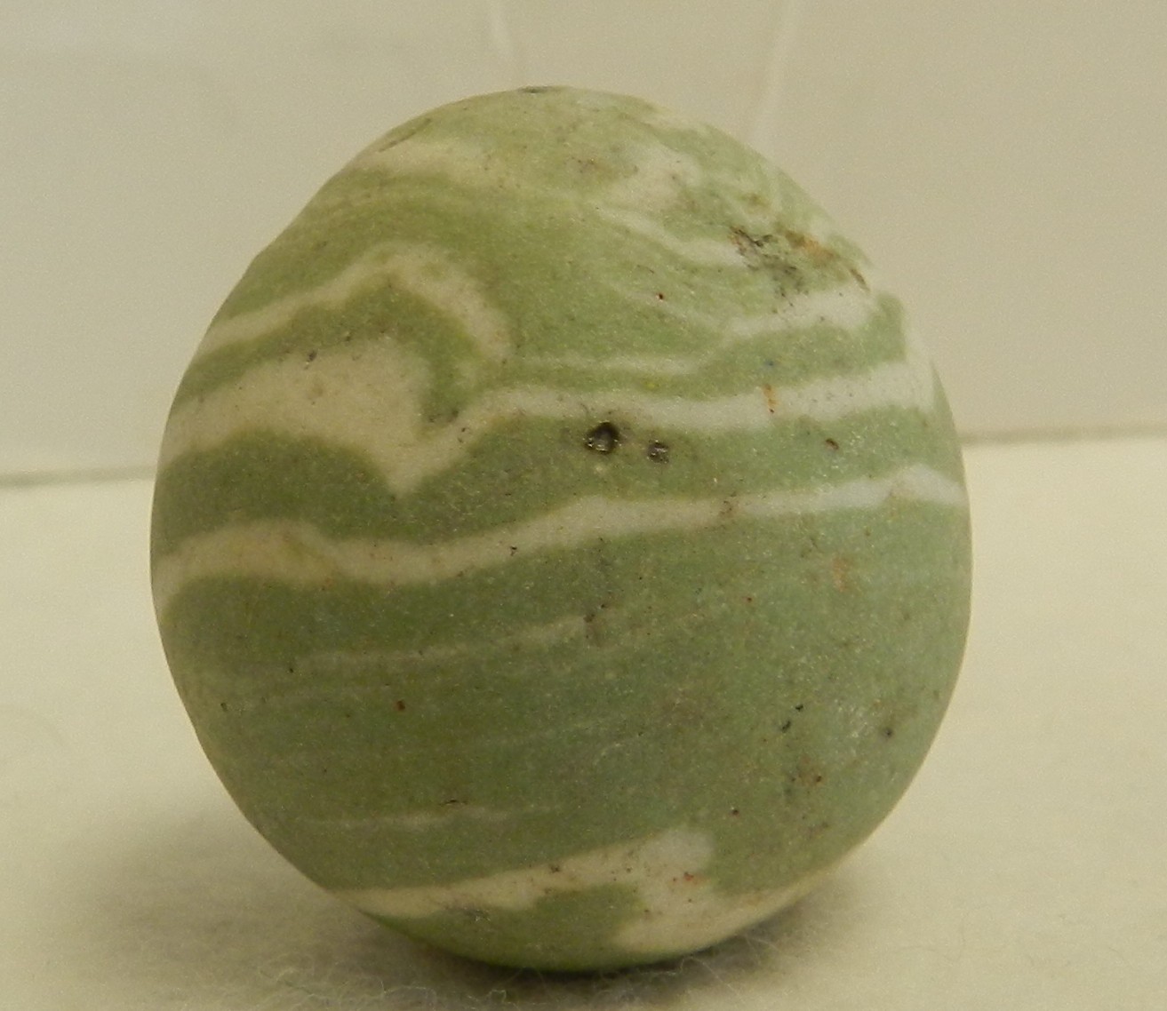 #20304m Vintage Error Out of Round Lined Crockery Shooter Marble 1.20 Inches