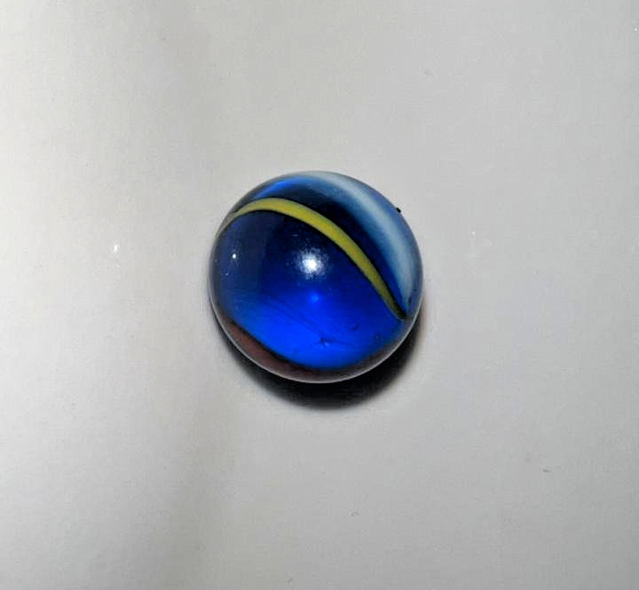 21 vintage handmade glass marbles with colorful swirls and unique patterns.