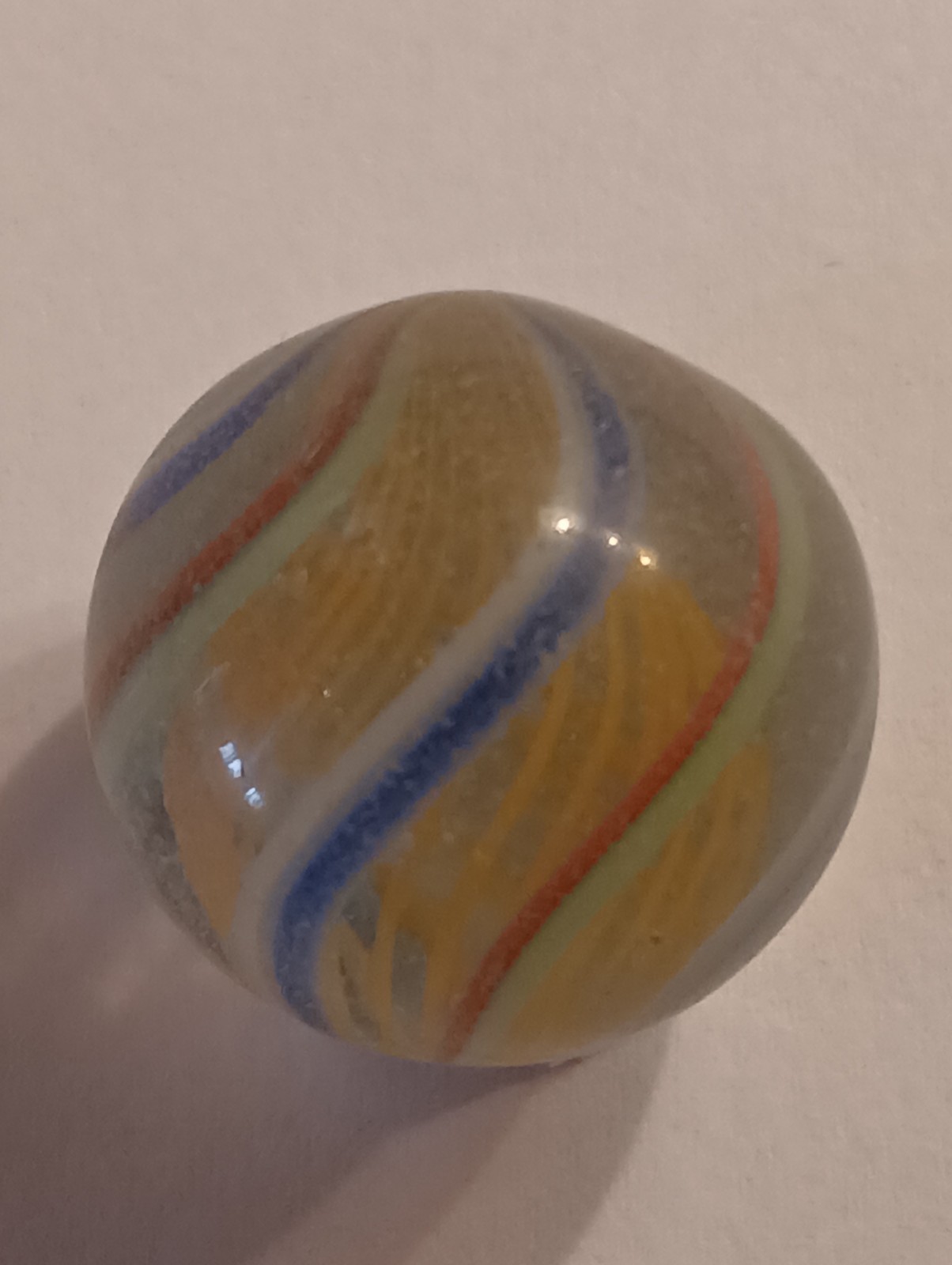 German Latticinio Yellow Core Marble. .74 Inch Blue White / Red Green Stripes