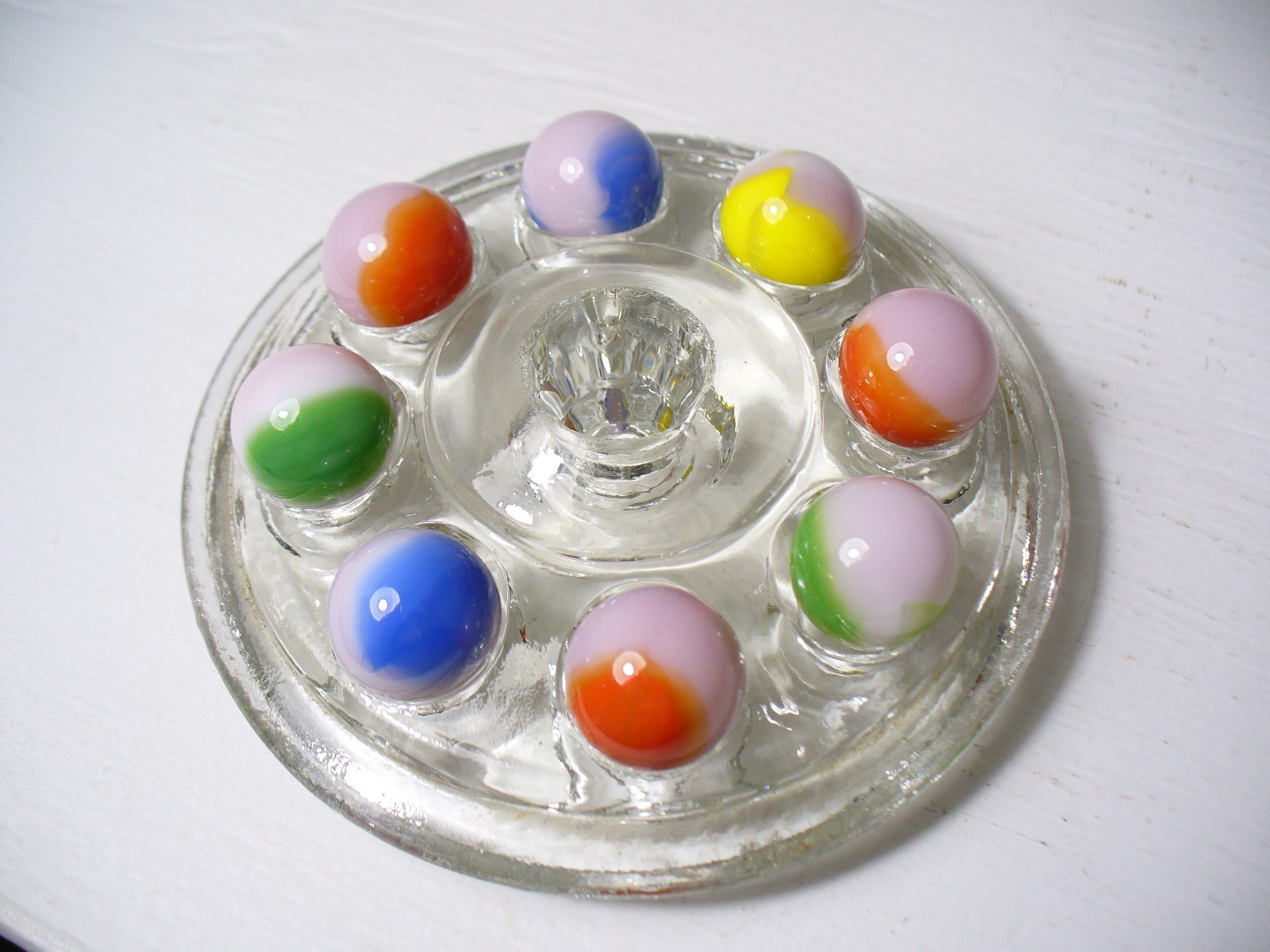 #916 Vintage Marble King Rainbows 8 Pieces all are on a Pink base.
