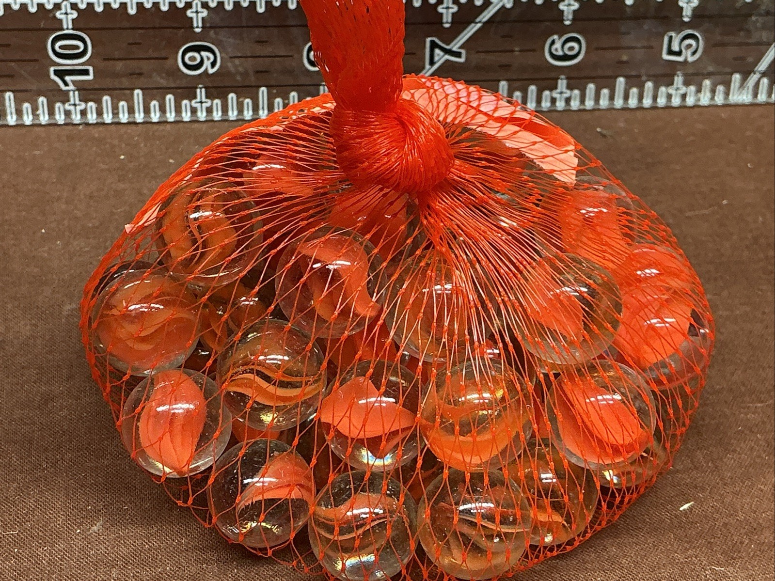 55 Orange Katseye Marbles, 10 Ounces