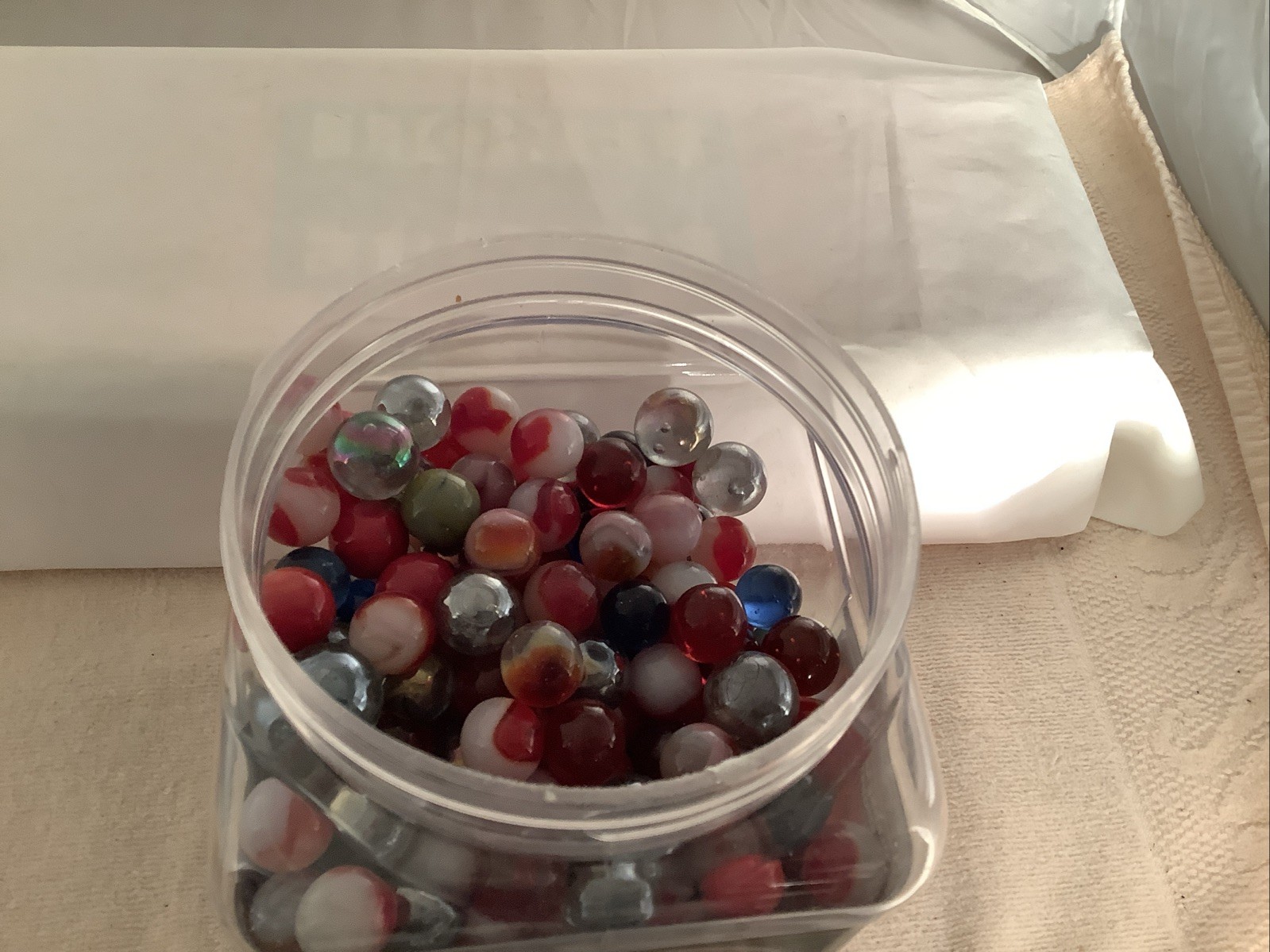 Plastic Bottle filled With A Mixture Of Marbles Found In A Garage.