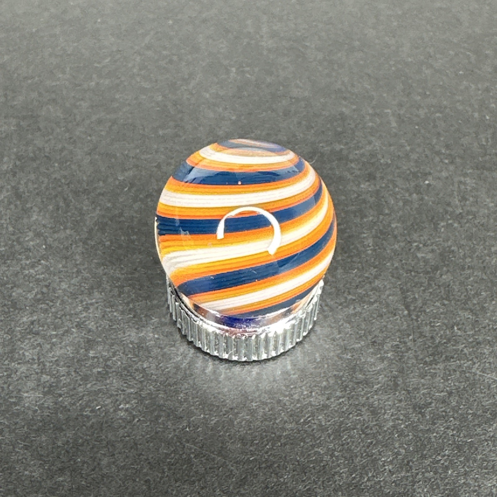 Contemporary Handmade Art Glass Marble .66″ Navy Blue White Orange UV Glow Swirl