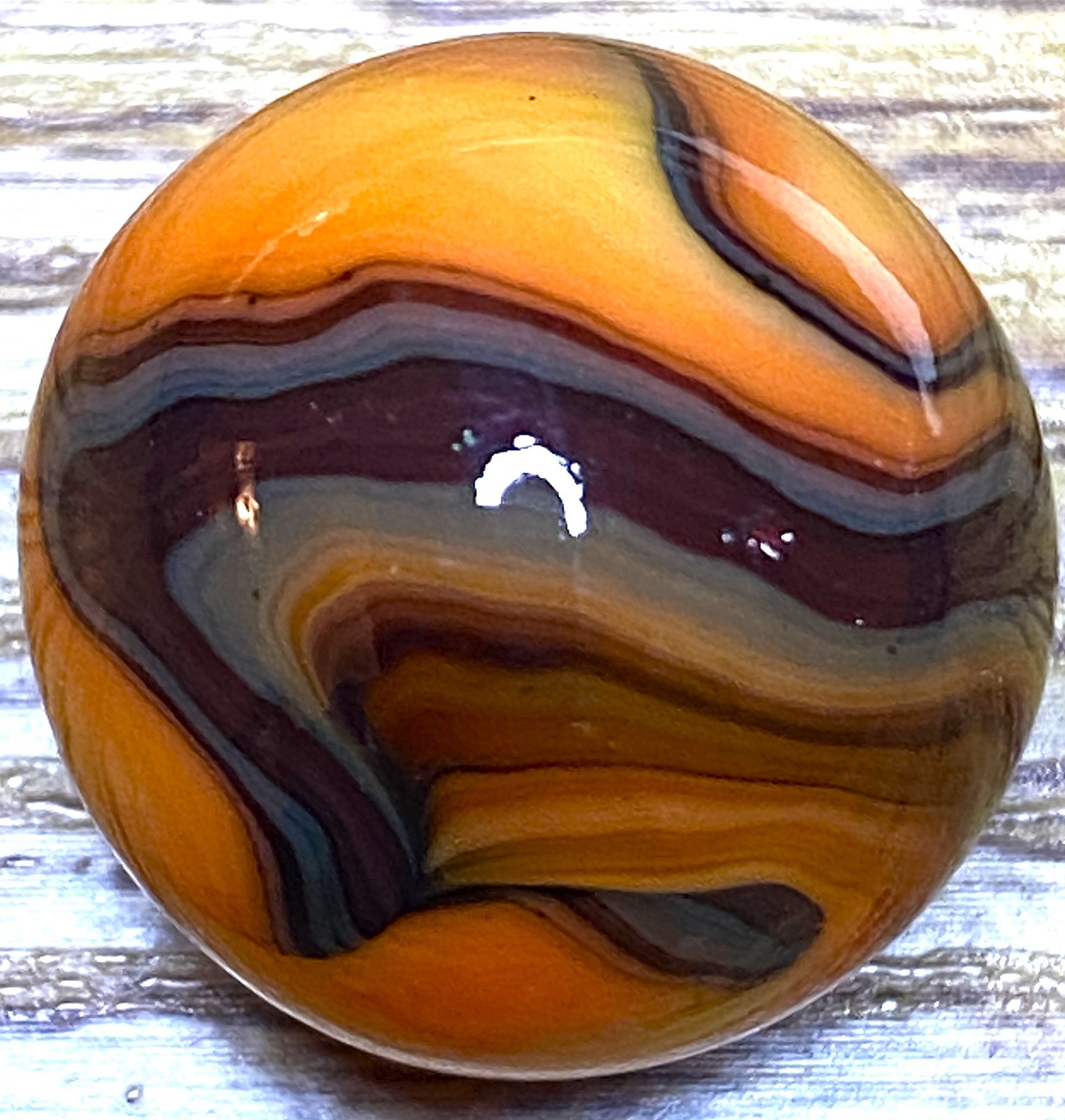 VERY DARK OXBLOOD AND CONTRASY ORANGE SWIRLED SHOOTER .73″ BOX03/121