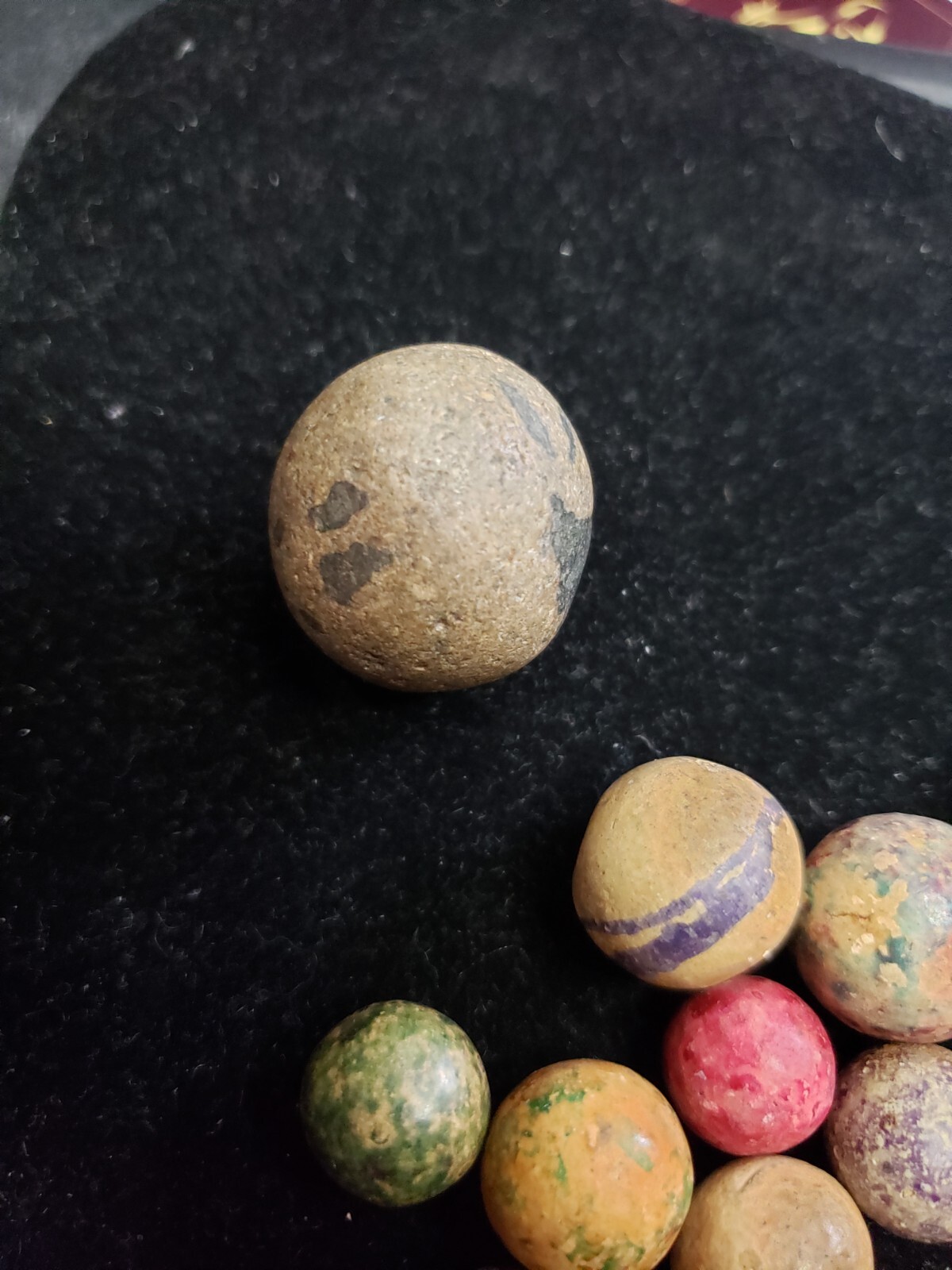 16 ANTIQUE CLAY MARBLES LARGEST 27MM
