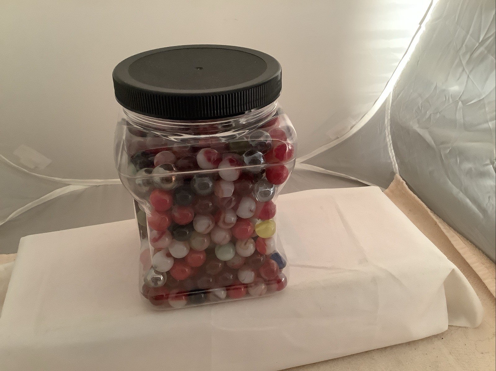 Plastic Bottle filled With A Mixture Of Marbles Found In A Garage.