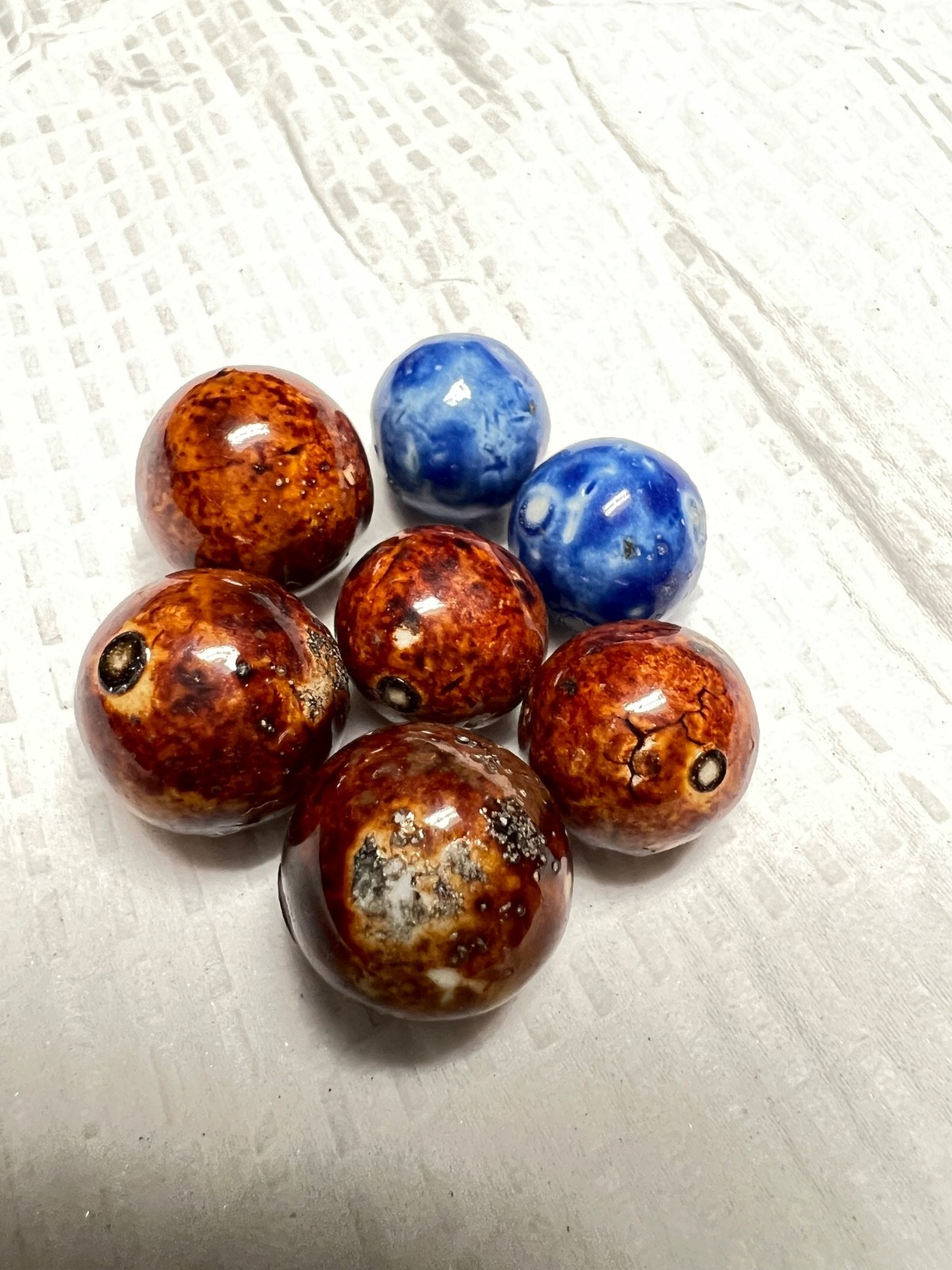 lot of seven bennington marbles, 3 are 1/2 i ch others are smaller 4 brown two b