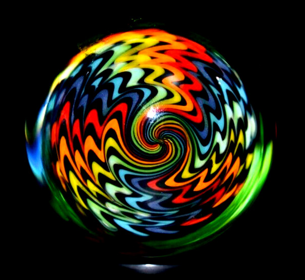 JOSHUA JUSTICE GLASS MARBLE/1.728″-DARK RAINBOW UV-NEON GREEN UNDER BLACKLIGHT