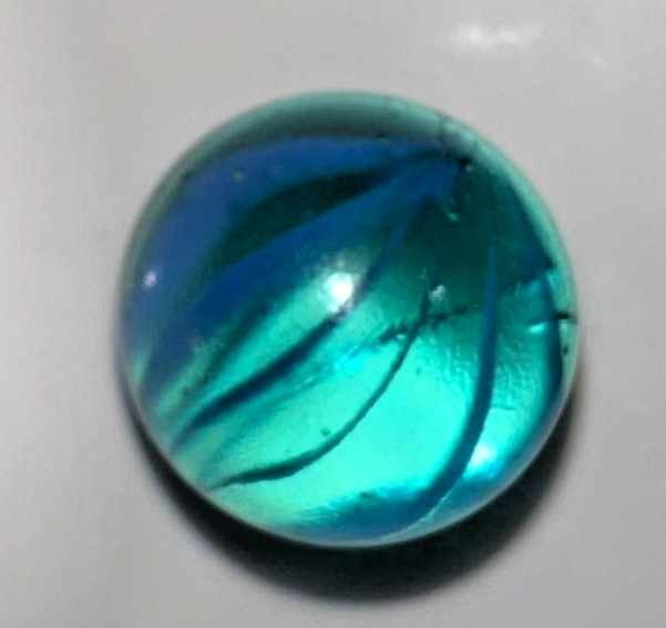 9 classic handmade glass marbles, featuring colorful swirls and unique patterns.