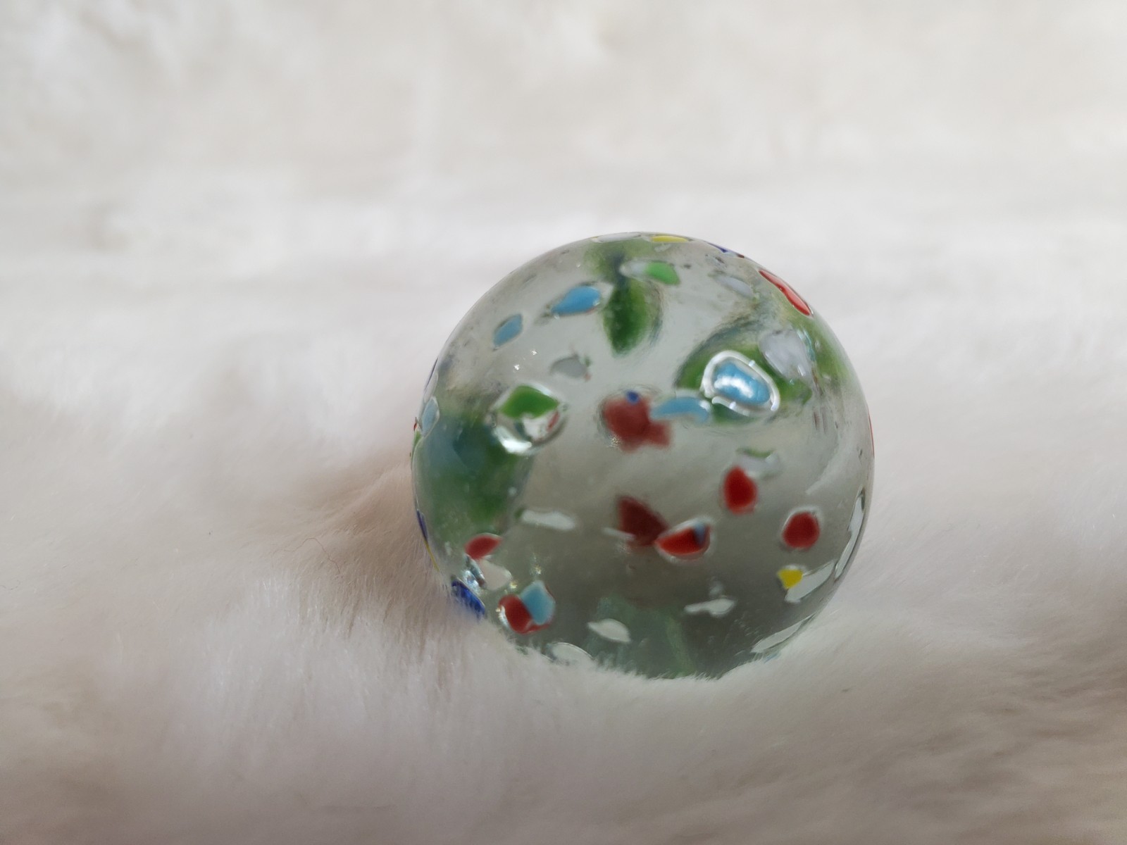 1″ Vintage confetti shooter marble – clear glass w/ multi colors on surface