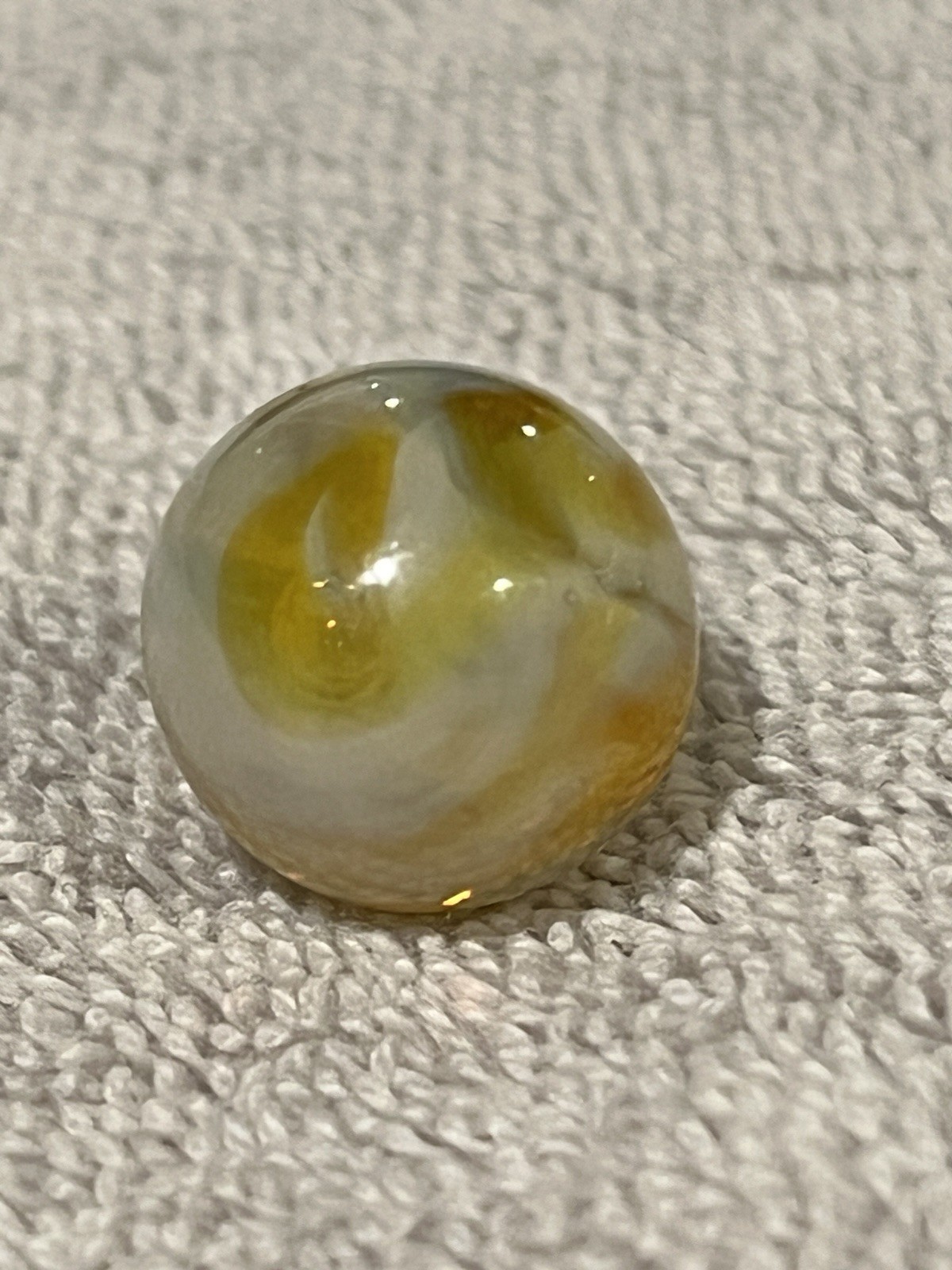 Alley or Champion Yellow Gold Translucent Furnace Swirl .63 Wet Mint