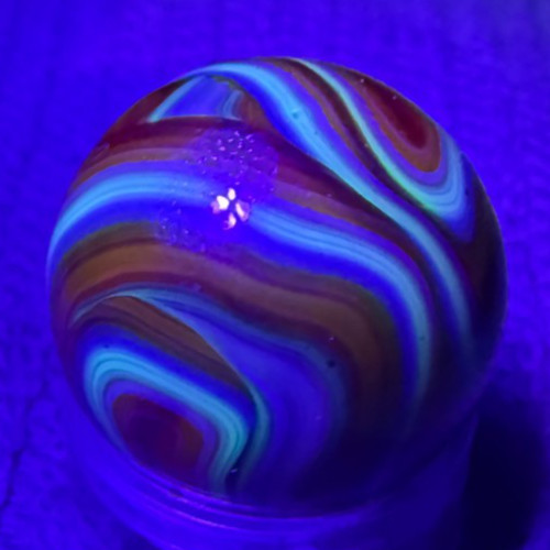 JABO / DAS .63″ Mint UV Glows Oxblood Orange Blue Yellow Swirl Marble (274)