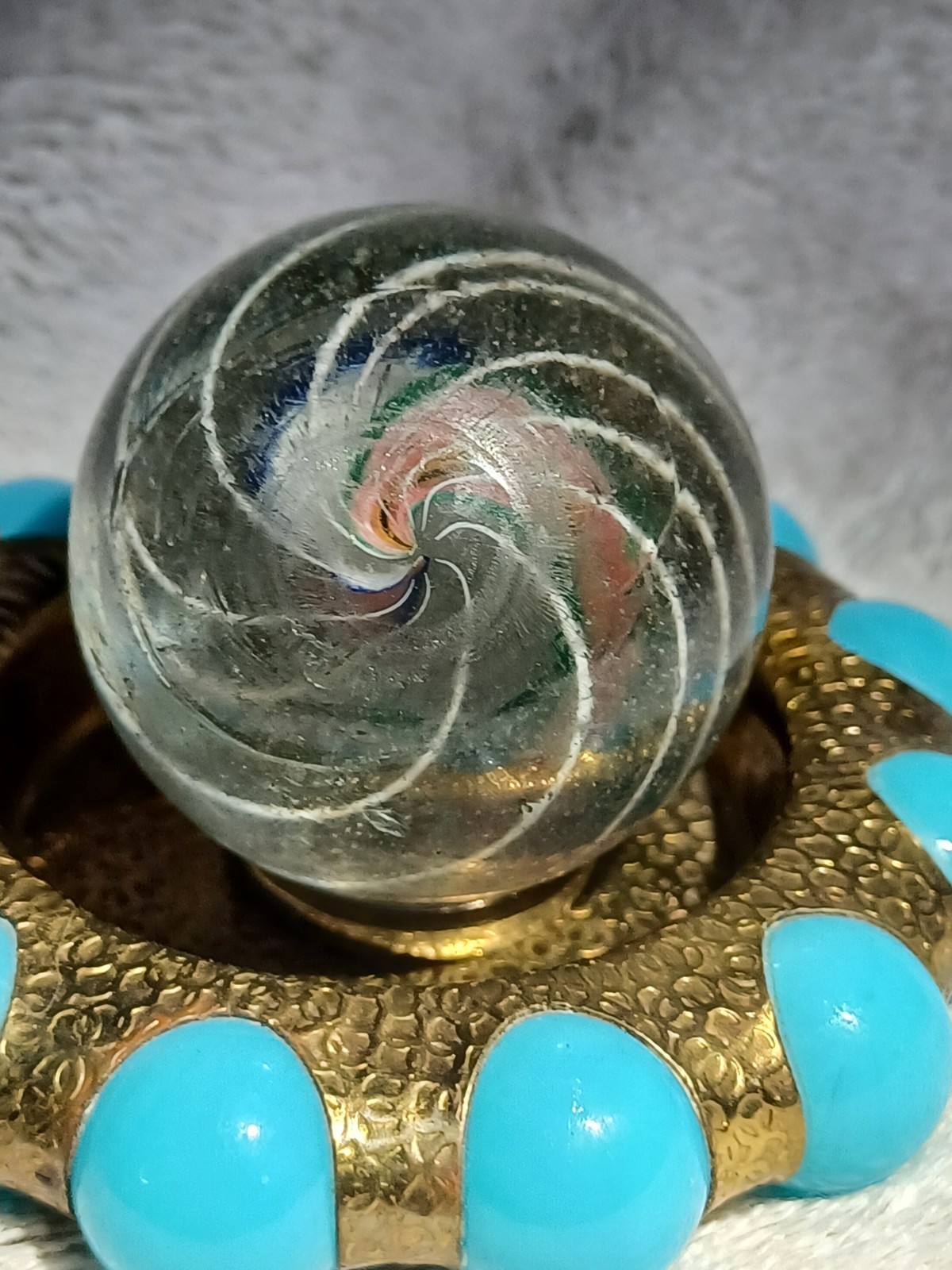 1.66″ Antique German “HM” swirl divided core marble, silver wedding band/Fisher.