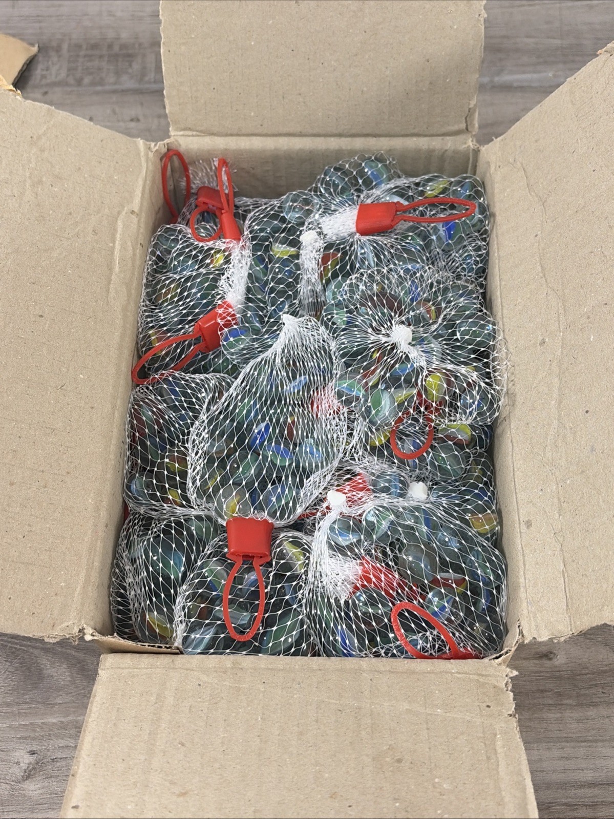 BOX OF 36 glass marble sets – netted bag of Approx 21 assorted marbles