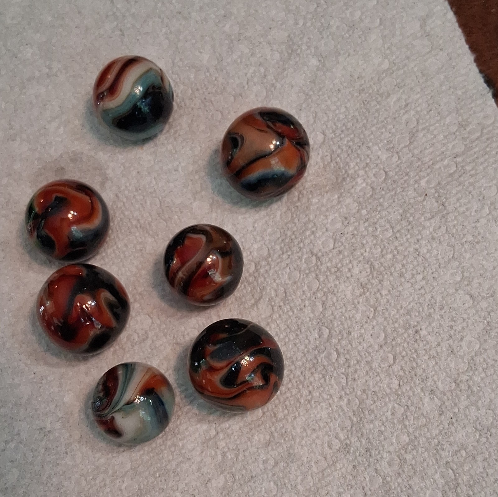 Lot of 7 Swirl Glass Toy Marbles Red White Blue Black Collector Display
