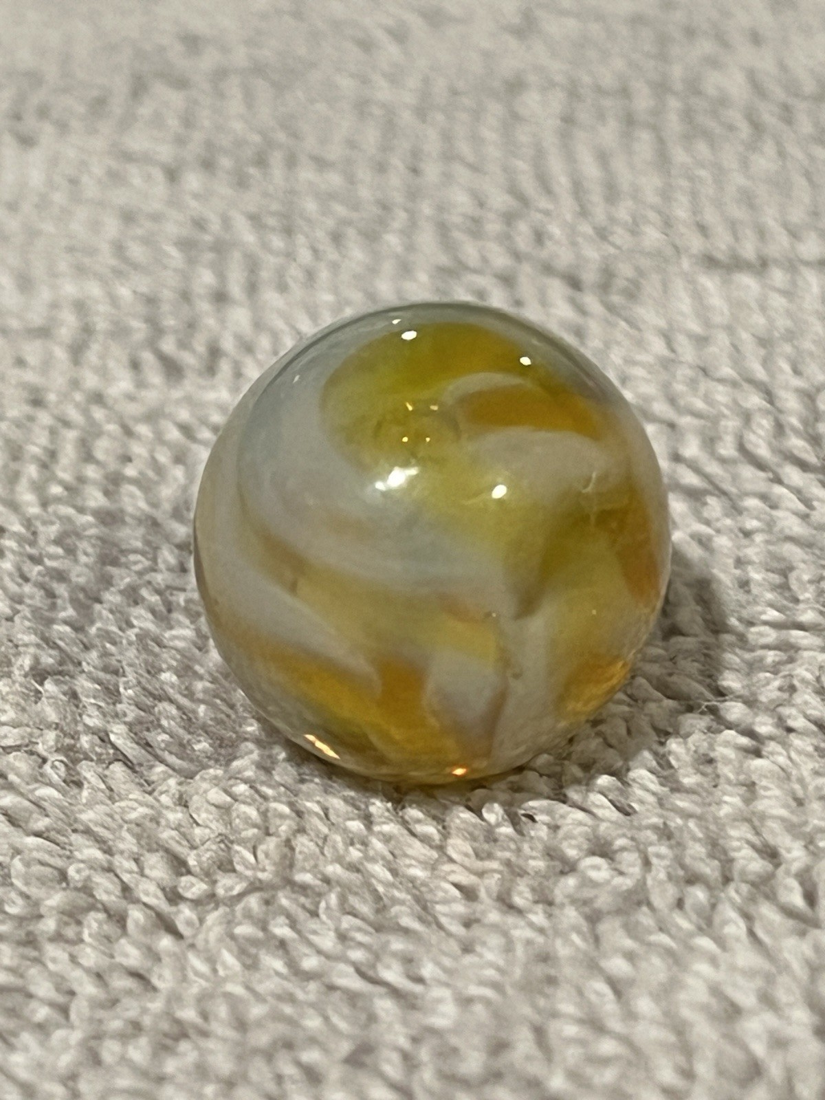 Alley or Champion Yellow Gold Translucent Furnace Swirl .63 Wet Mint