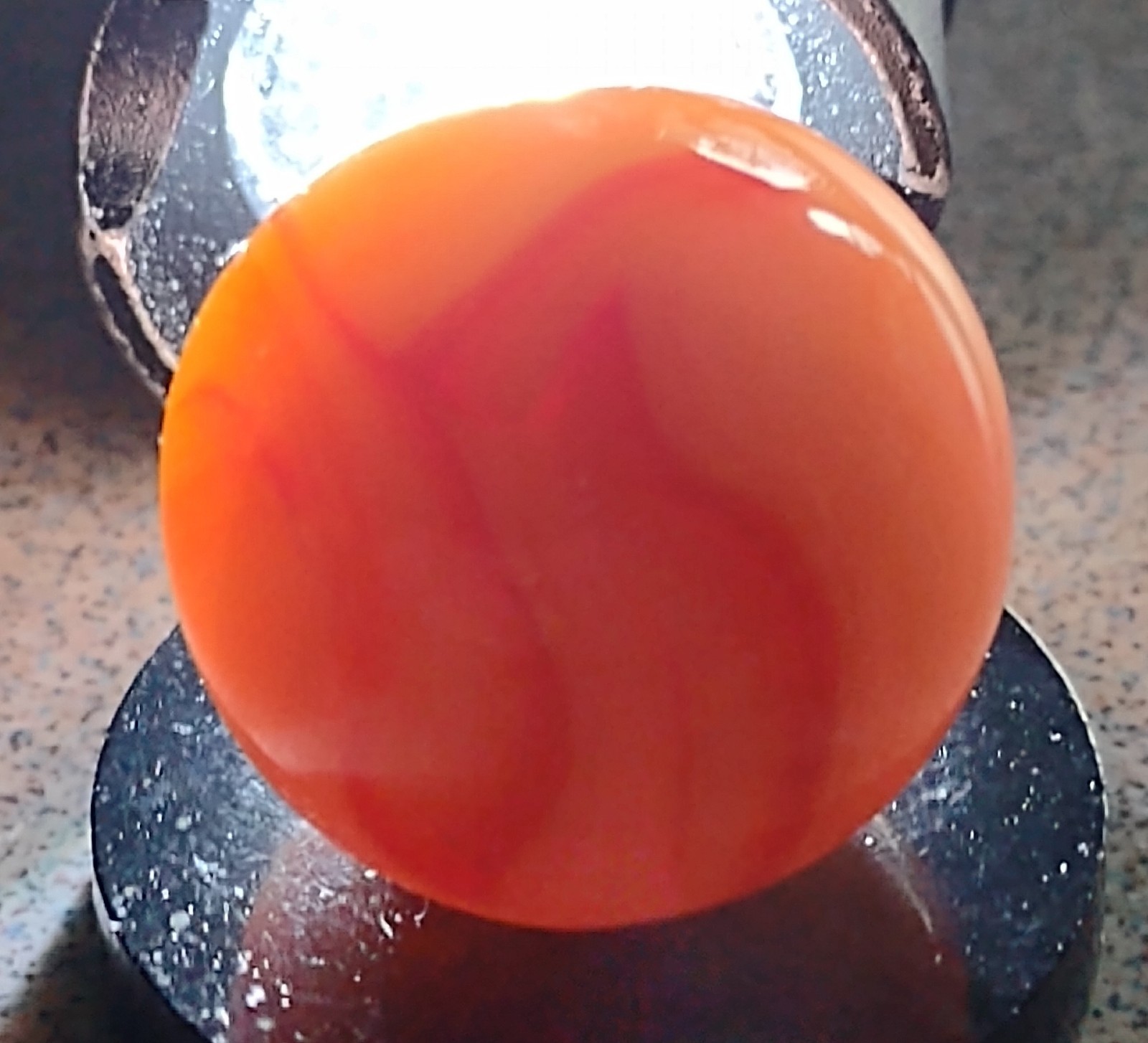 West Virginia Swirl marble-.59″ Mint-, red/orange swirls, mossy Transl. base-***