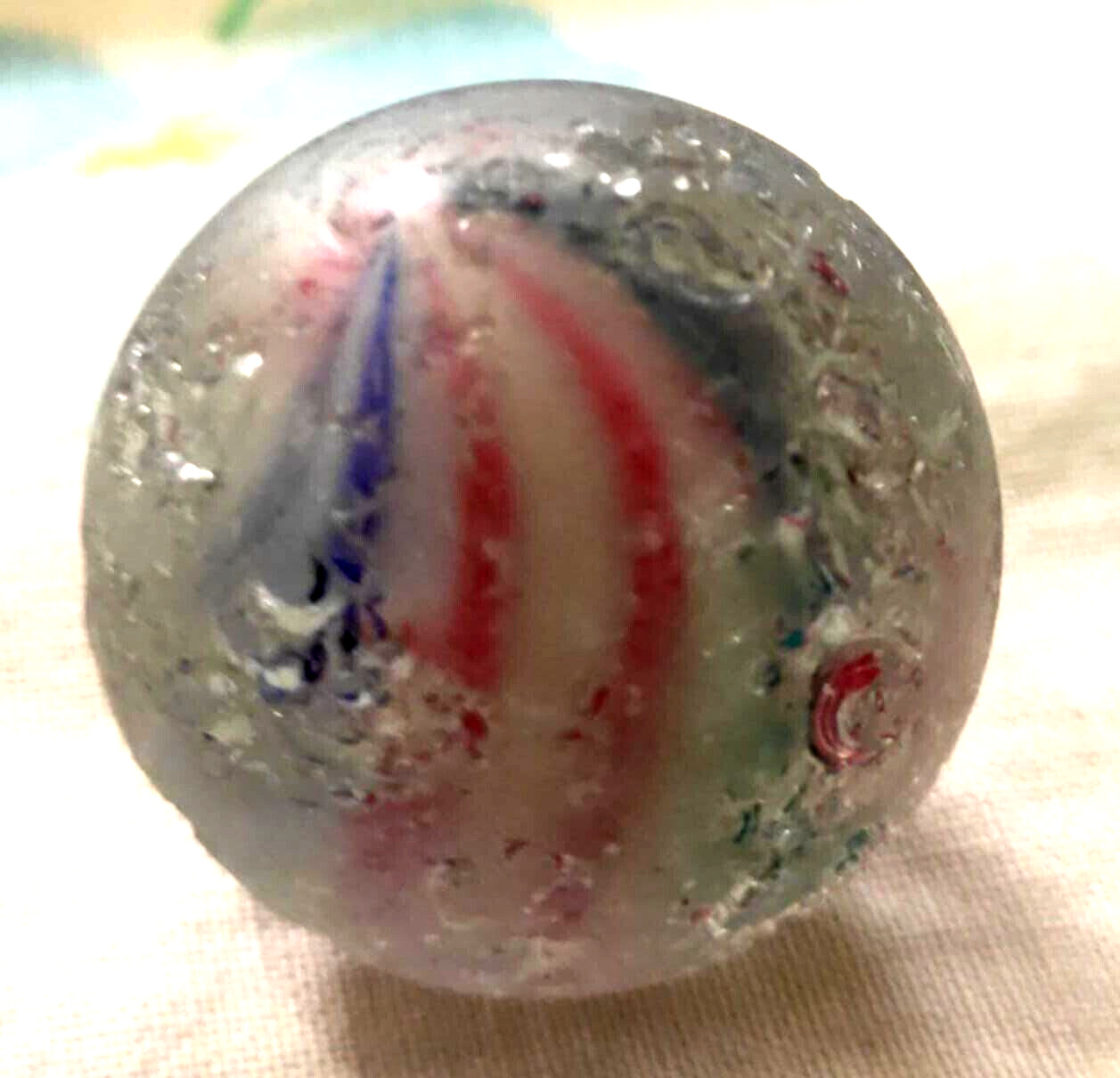 TOY MARBLE 1.1” marble trilevel ,solid core, 4 panel ribbon swirl, requ ground