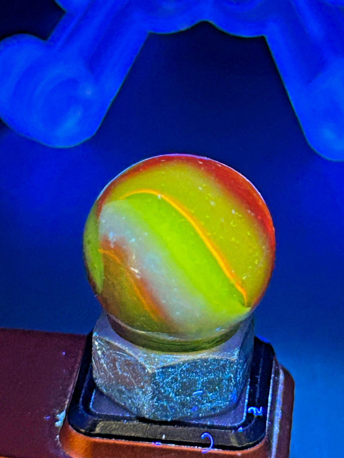 Peltier NLR Tri-Lite Marble, Green Base/Orange-Red Ribbon, UV Reactive, .63″ P28