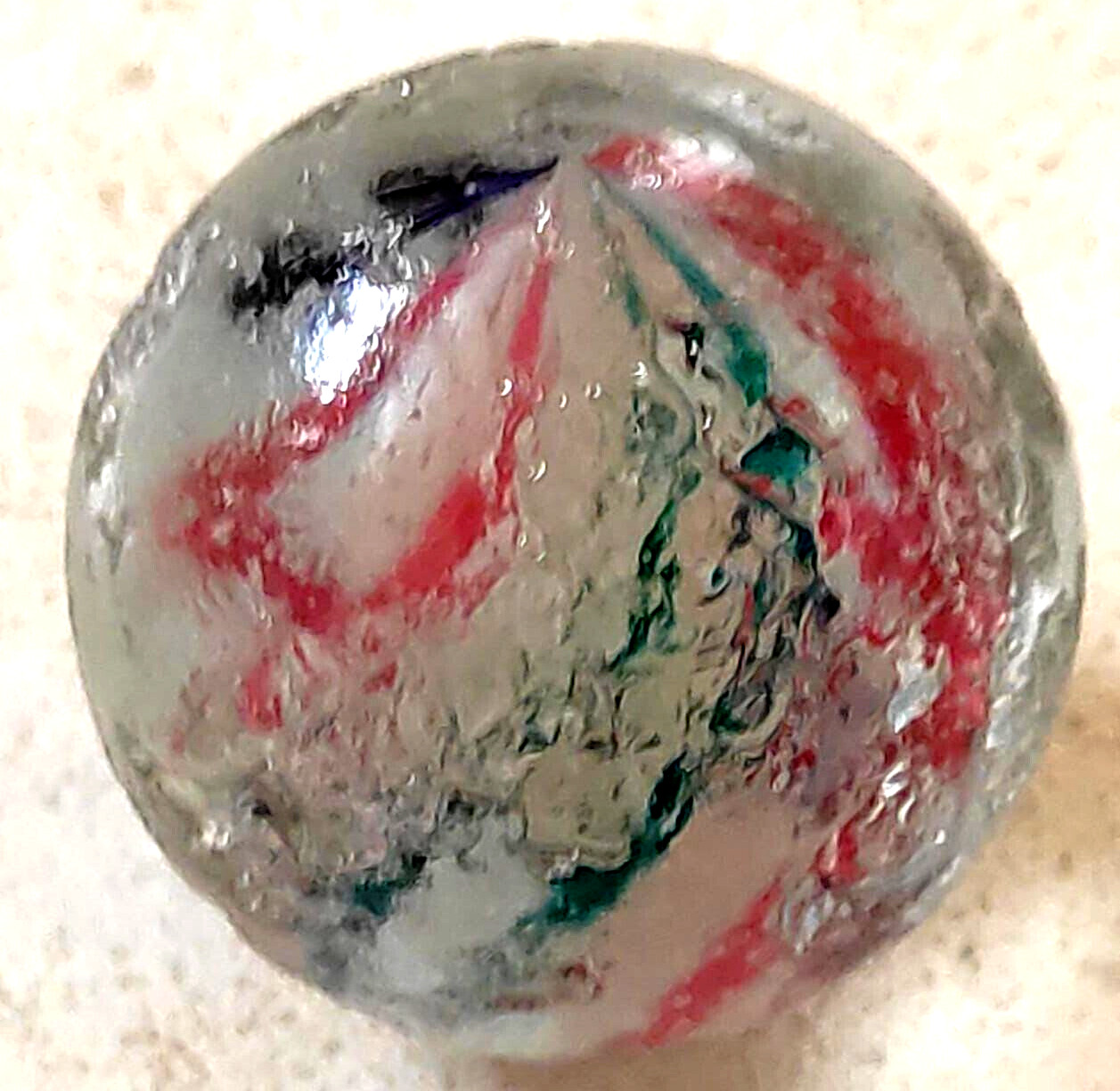 TOY MARBLE 1.1” marble trilevel ,solid core, 4 panel ribbon swirl, requ ground