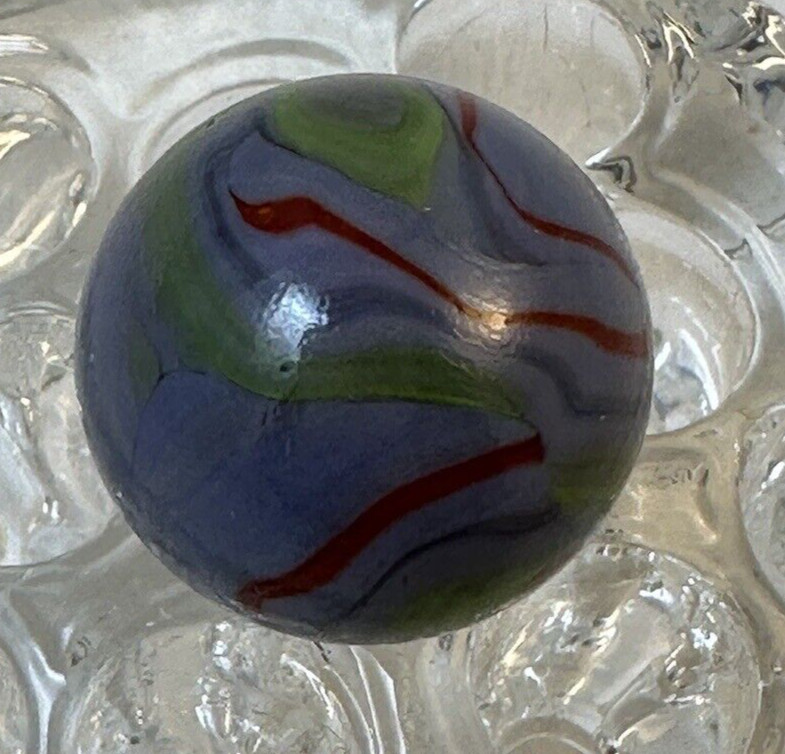 9/16 GREY/BLUE SHOOTER MARBLE WITH SWIRLS OF BLUE, RED & YELLOW BANDS