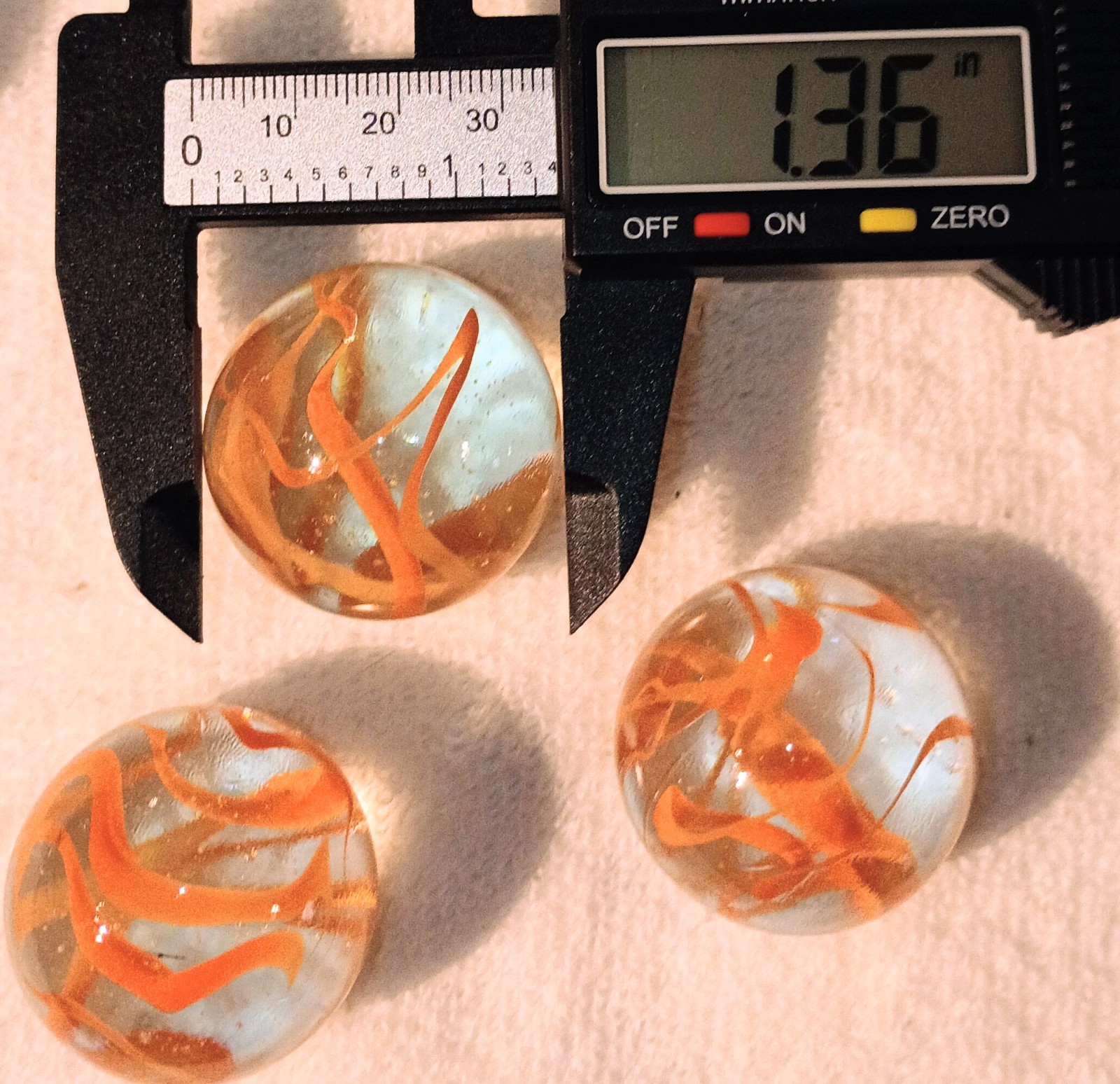 1.36 “Spaghetti” Glass XL Shooter Marbles Pack of 4 Clear w/ Orange Swirls
