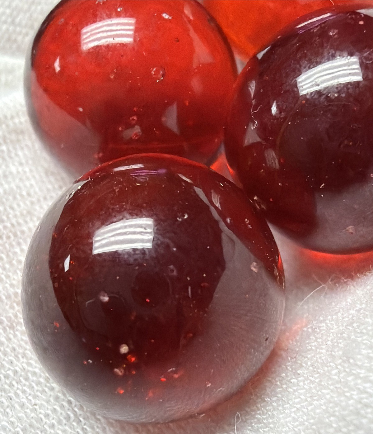 Vintage Lot of 4 Clear Ruby Red Cadmium Slag Glass Marbles UV Reactive As Is