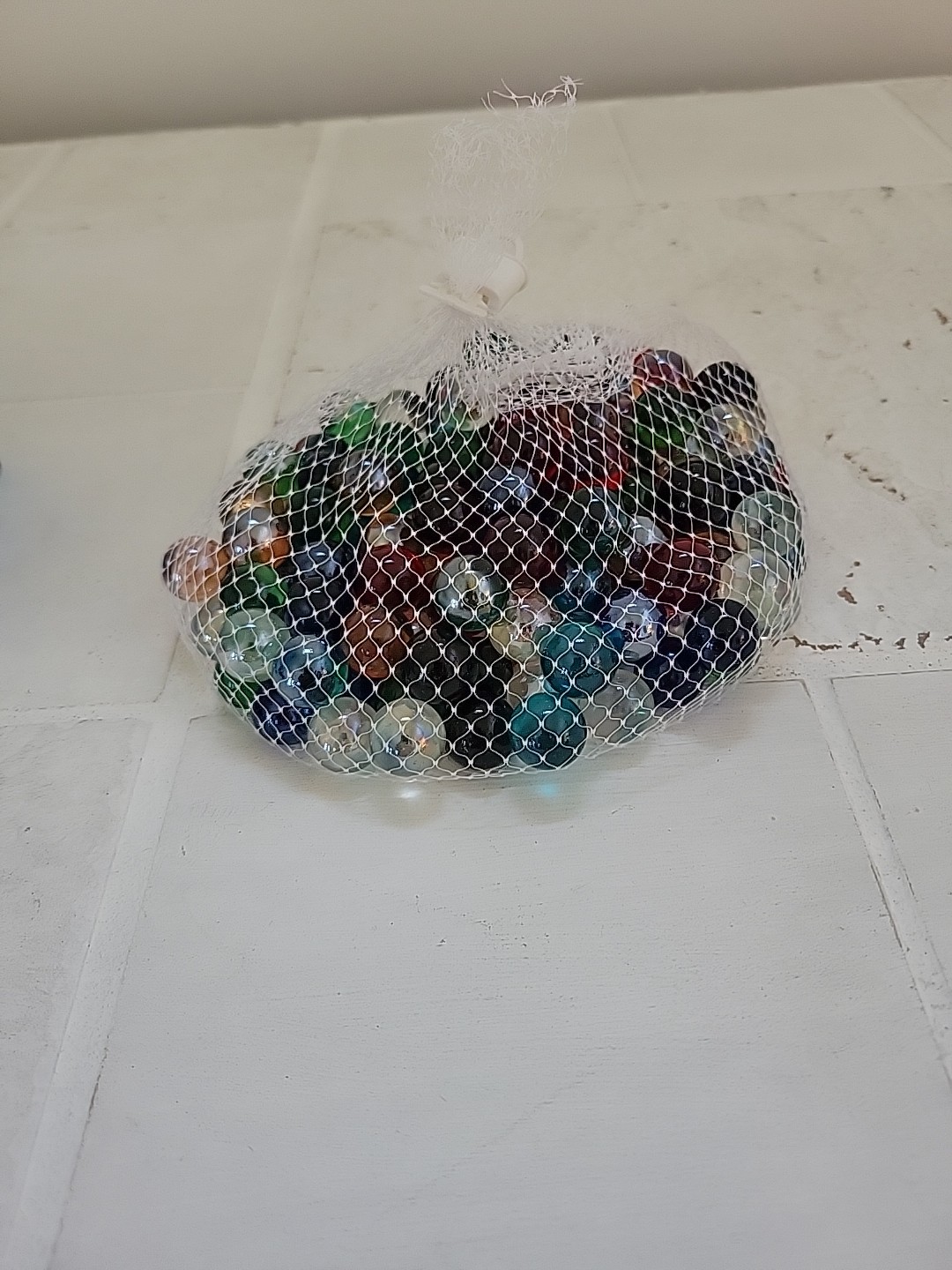 150 pc. Multi-colored glass marbles by Futureplusx.Still in bag and box